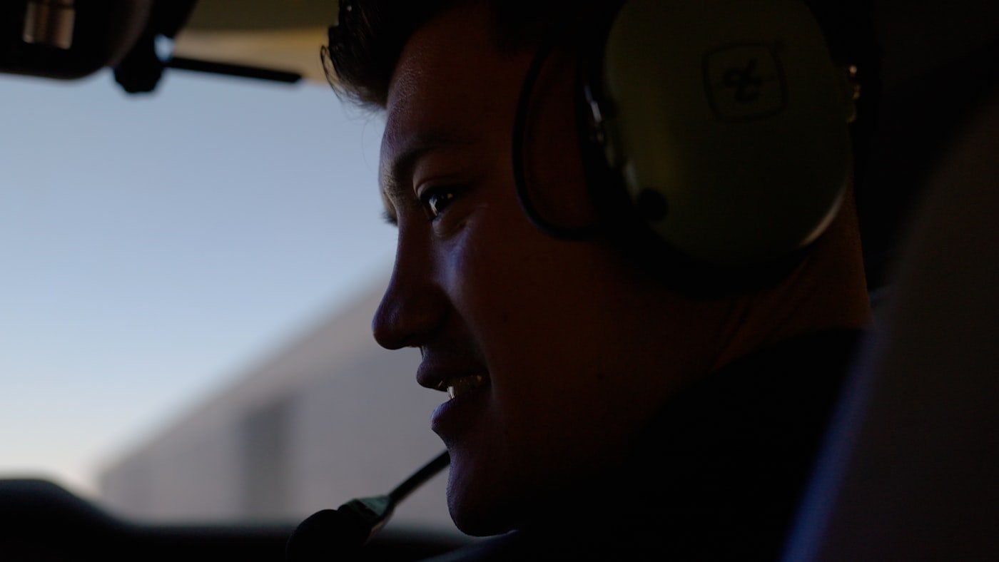 Airline pilot at the controls in the cockpit